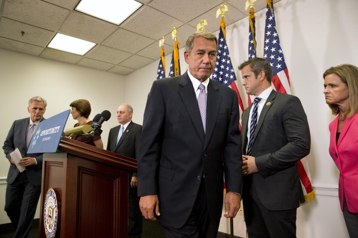 Speaker of the House John Boehner of Ohio leaves the lectern after speaking about his opposition to the Iran deal at a news conference with members of the House Republican leadership in Washington.