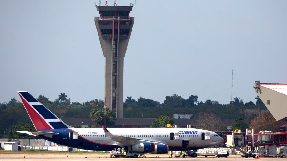 A Cubana Airlines aircraft is stationed at the Jose Marti International Airport in Havana. Frontier Airlines and Silver Airways are the latest to cut service to the island nation.