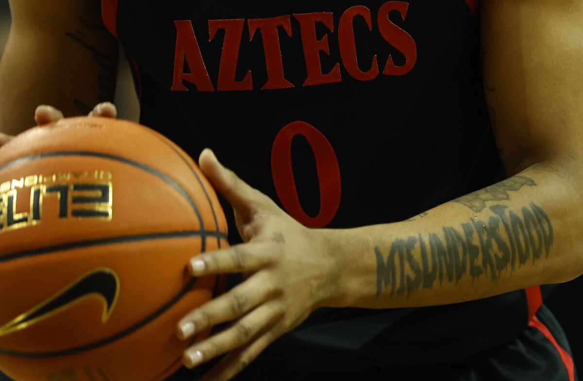 The tattoo on San Diego State's Keshad Johnson's arm tells a story.