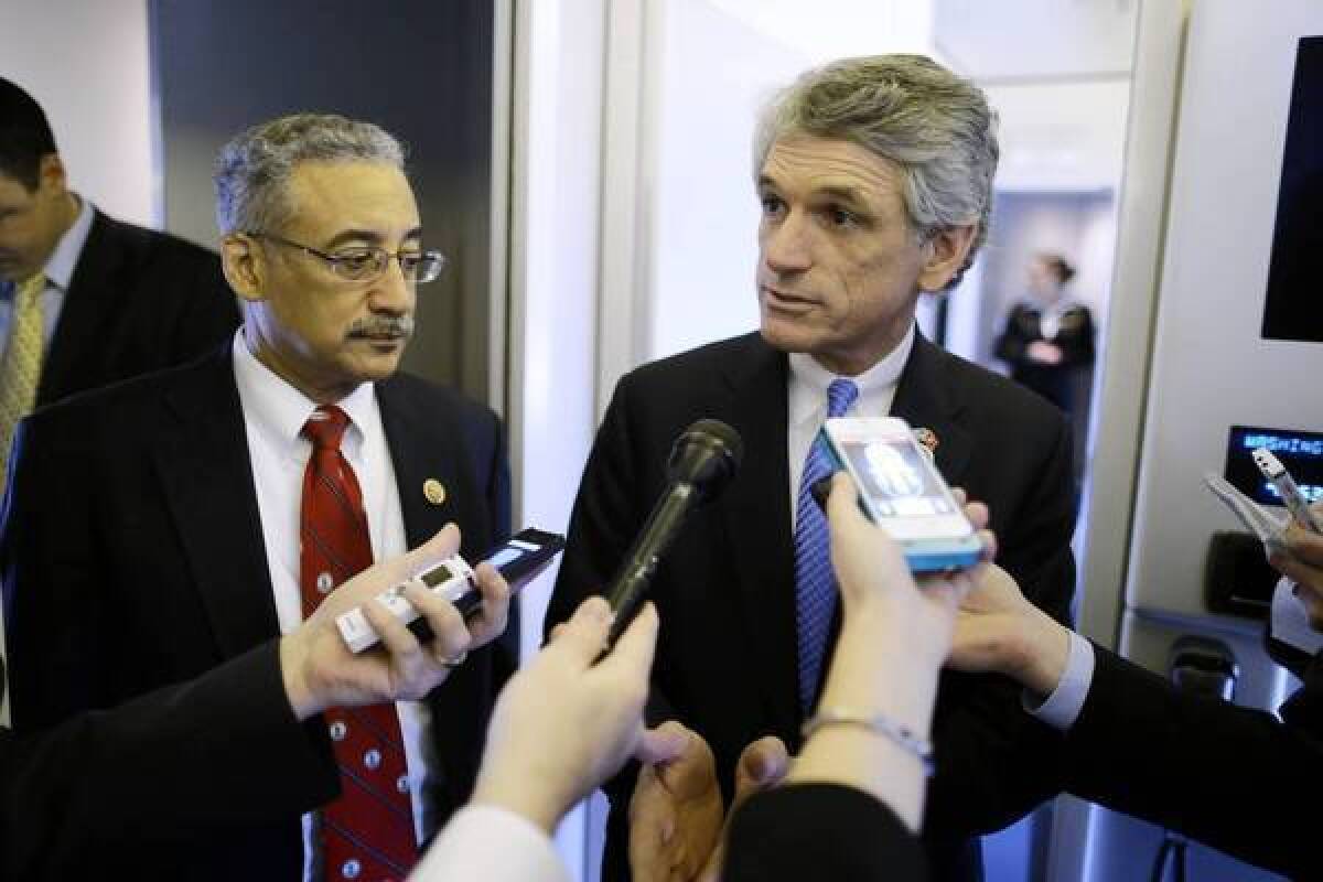 Rep. Scott Rigell, R-Va., right, seen with Rep. Bobby Scott in February, said of the contractor's detention: "Justice has not yet been served. Those who unlawfully detained him need to be held accountable, especially given that this occurred at the hands of those who are supposed to be our ally."