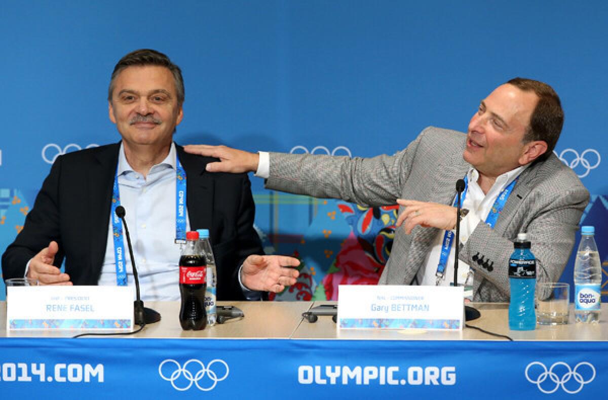 International Ice Hockey Federation President Rene Fasel and NHL Commissioner Gary Bettman -- who agreed on the day's attire, at least -- joke around during a news conference on Tuesday at the Sochi Olympics.