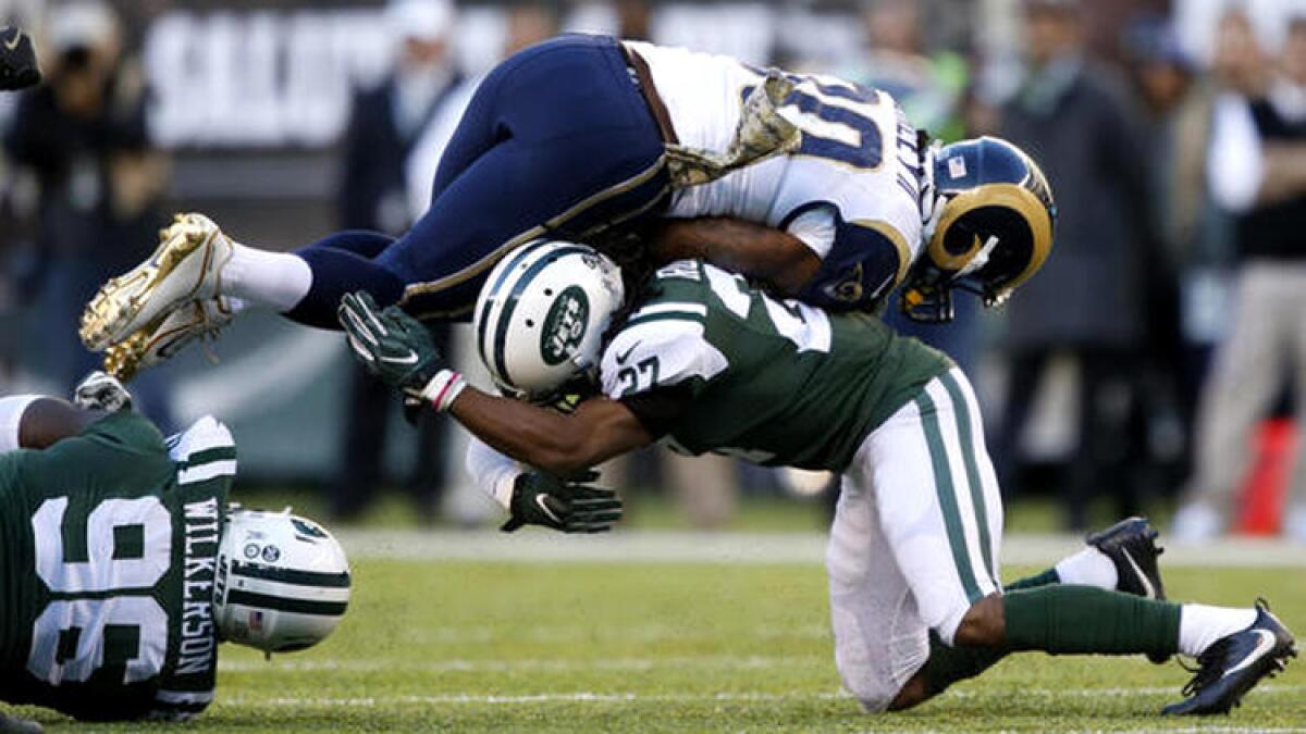 Rams running back Todd Gurley is upended by Jets cornerback Darryl Roberts during the second half. To see more images from the game, click on the photo above.