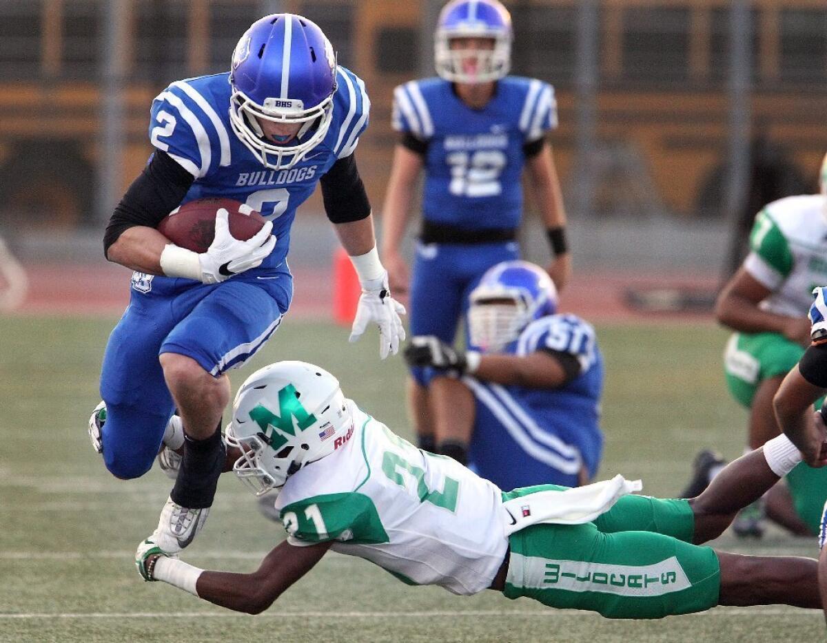 Burbank High's Forest Fajardo and the Bulldogs rolled past Monrovia to begin the season on Friday.