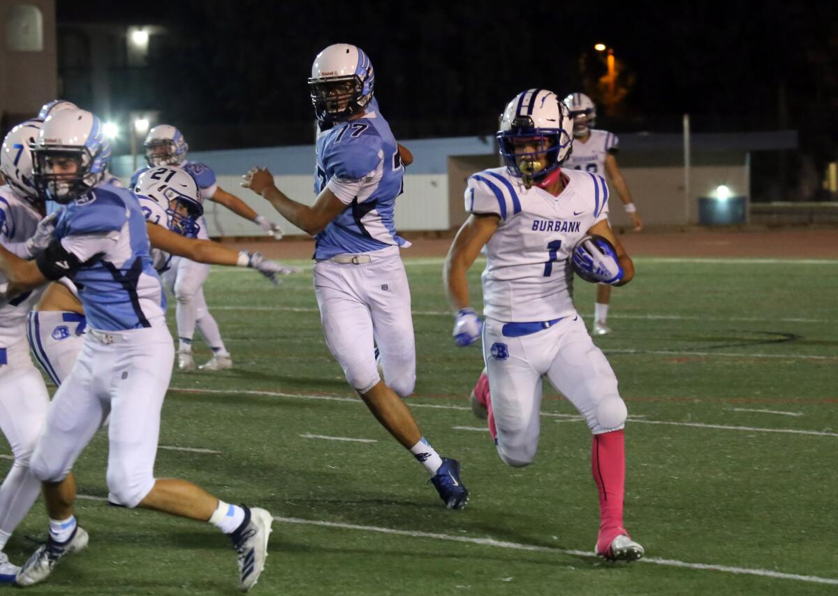 Burbank High's running back Isaac Glover (1) tries to get some yardage during Burbank High School's varsity football team against Crescenta Valley High School's varsity football team in a Pacific League game at Glendale High School in Glendale, Ca., Friday, October 4, 2019. (photo by James Carbone)