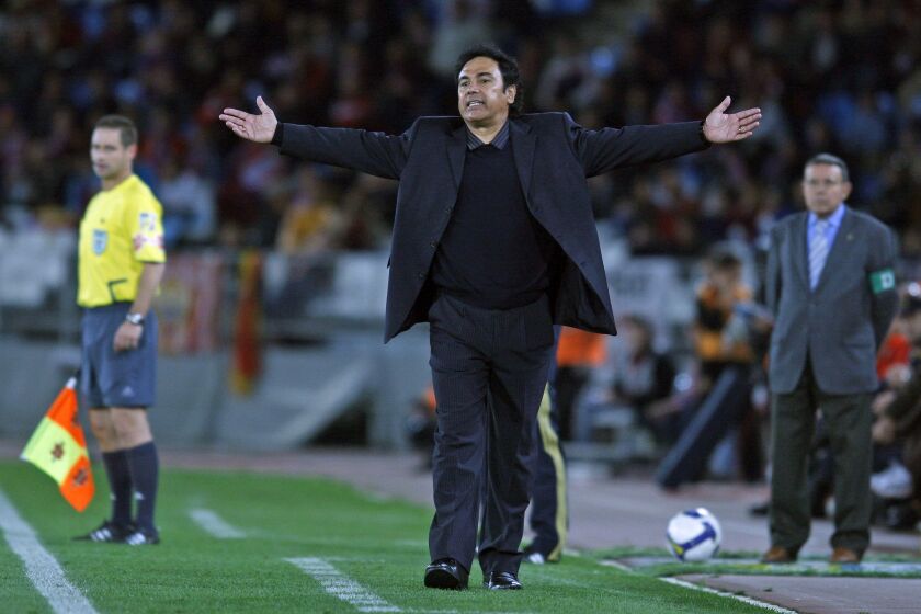 FILE - In this March 15, 2009, file photo, Almeria's coach Hugo Sanchez, front, reacts during a Spanish La Liga soccer match against Barcelona at the Mediterraneo Stadium in Almeria, Spain. Former Real Madrid striker and Mexico coach Hugo Sanchez was named Tuesday, May 15, 2012, as the new coach of Mexican club Pachuca. (AP Photo/Sergio Torres, file)