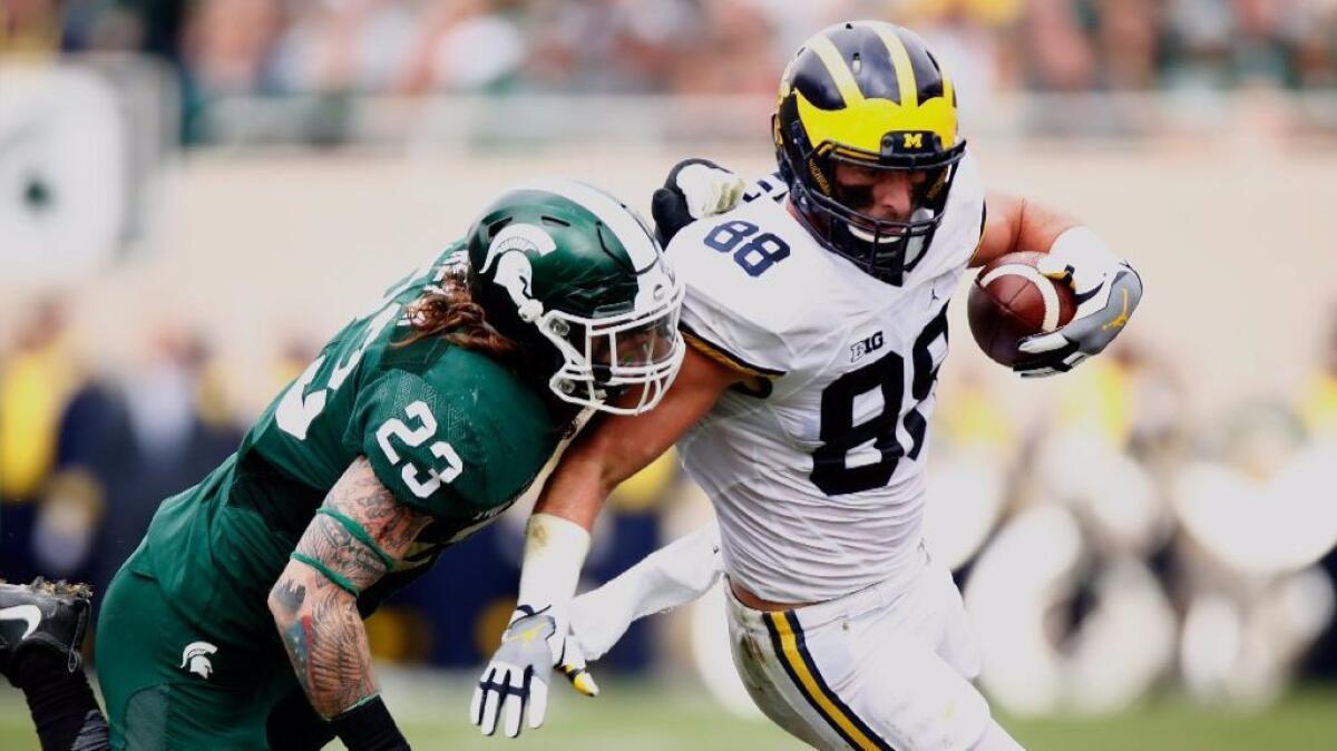 Michigan tight end Jake Butt works against Michigan State's Chris Frey during a game on Oct. 29.