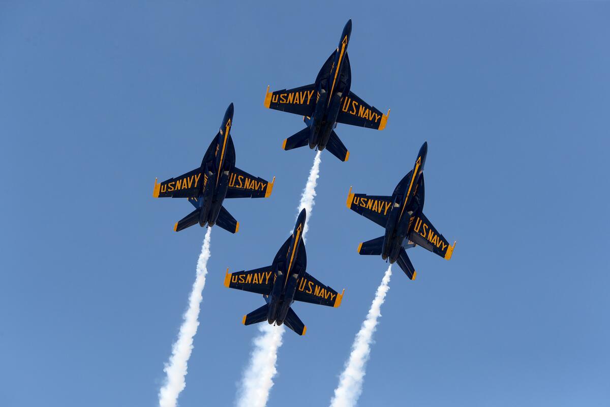 The U.S. Navy Blue Angels fly over Huntington Beach on the first day of the 2021 Pacific Airshow.
