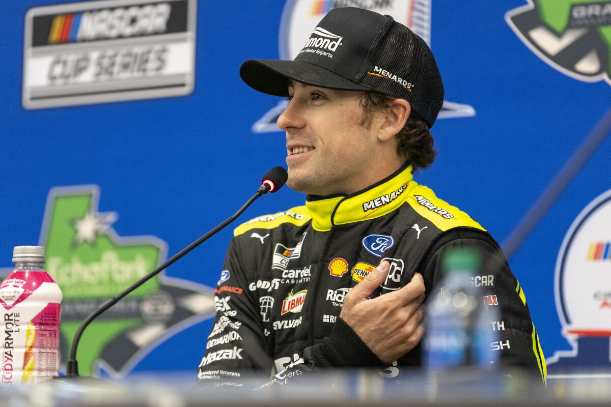 Ryan Blaney speaks about qualifying on the pole position for the NASCAR Cup Series auto race at Circuit of the Americas, Saturday, March 26, 2022, in Austin, Texas. (AP Photo/Stephen Spillman)