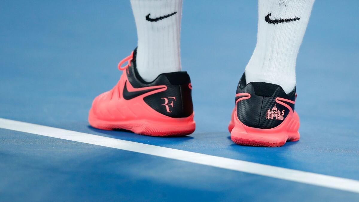 Nike shoes and socks adorn the feet of tennis star Roger Federer as he competes at the 2018 Australian Open.