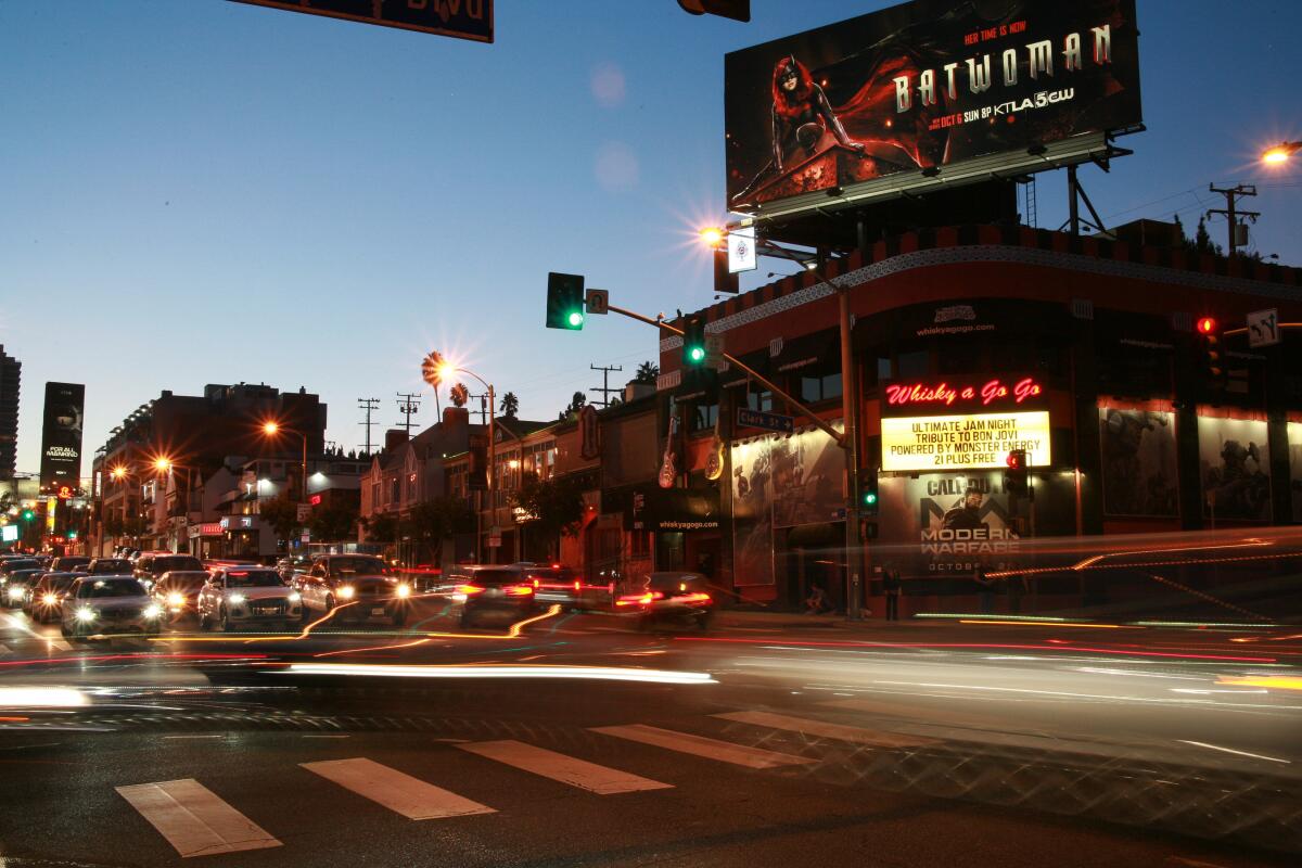Cars on Sunset Boulevard pass the Whisky a Go Go nightclub in West Hollywood in 2019.