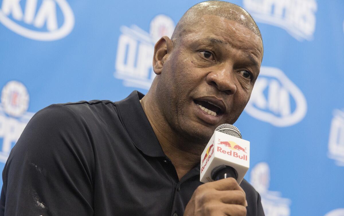 Clippers Coach Doc Rivers takes questions at the team's media day on Sept. 26.