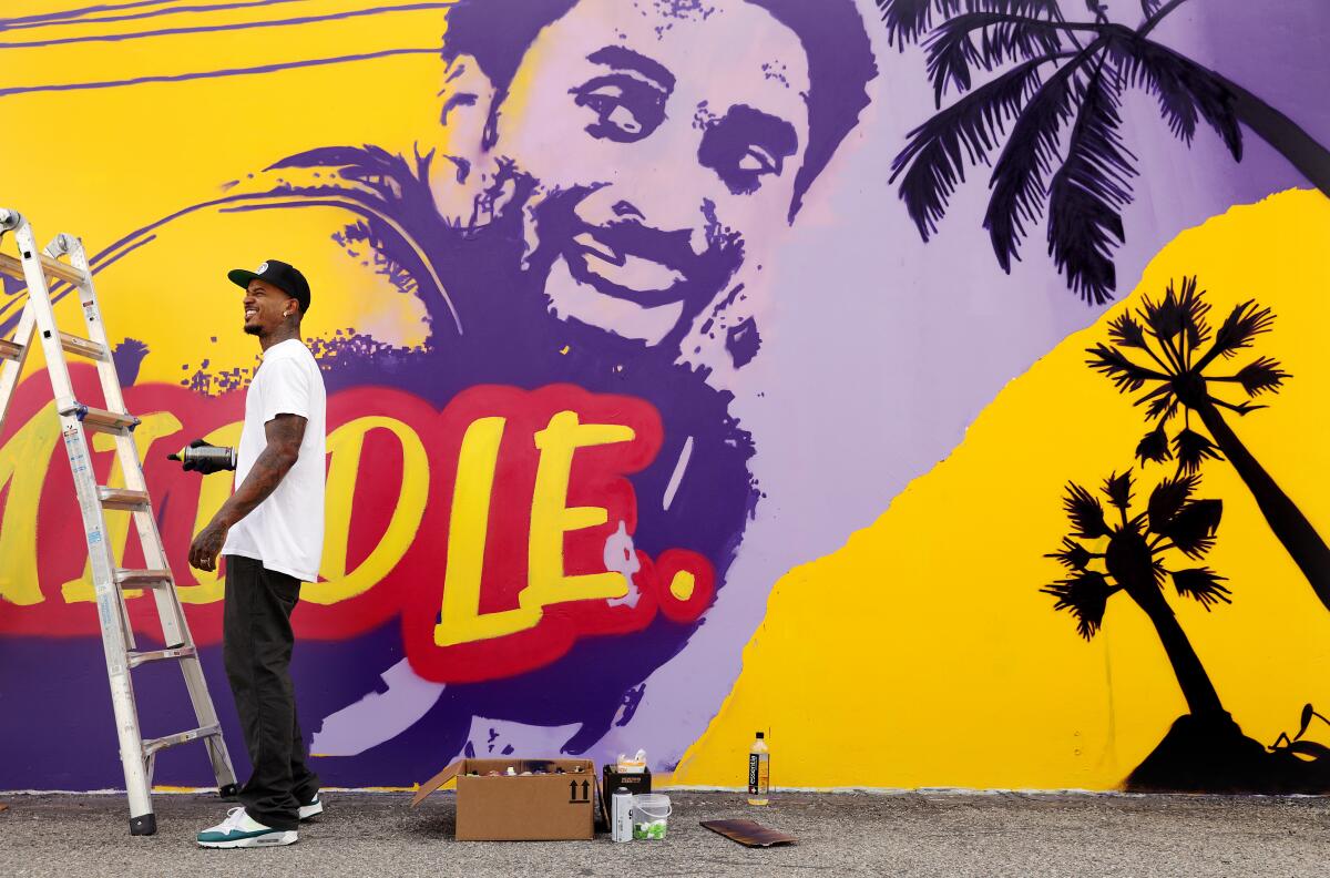 Tony "Concep" Brown works on a new Kobe Bryant tribute mural in Santa Ana.