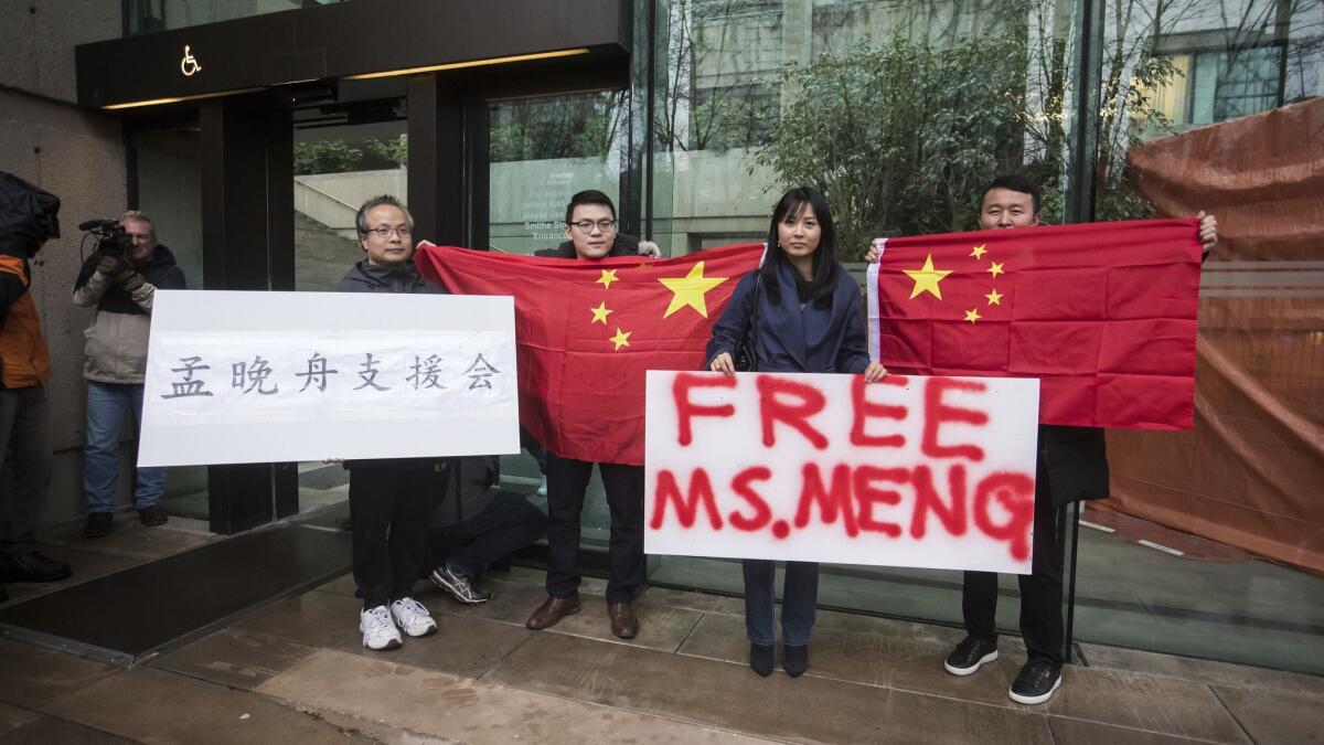 Supporters of Huawei executive Meng Wanzhou demonstrate outside the Supreme Court of British Columbia in Vancouver, Canada.