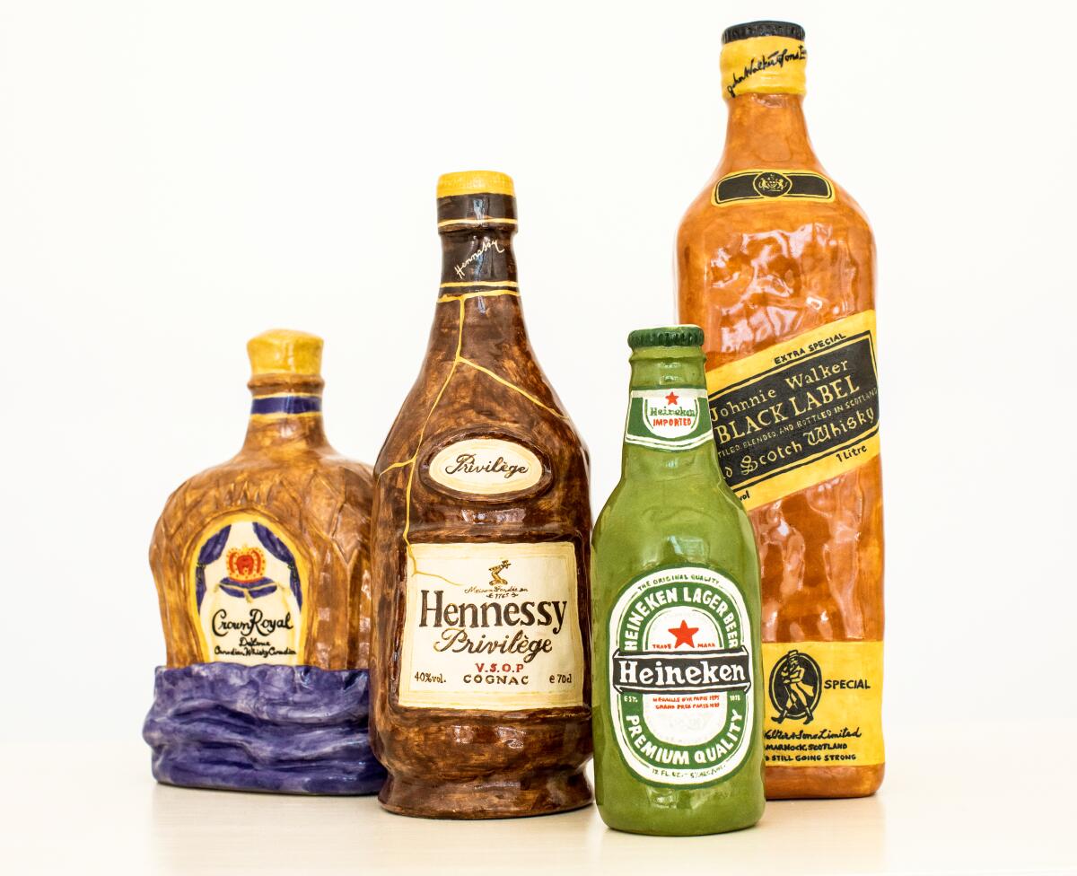 Ceramic bottles of Crown Royal, Hennessy, Heineken and Johnnie Walker Black Label. 