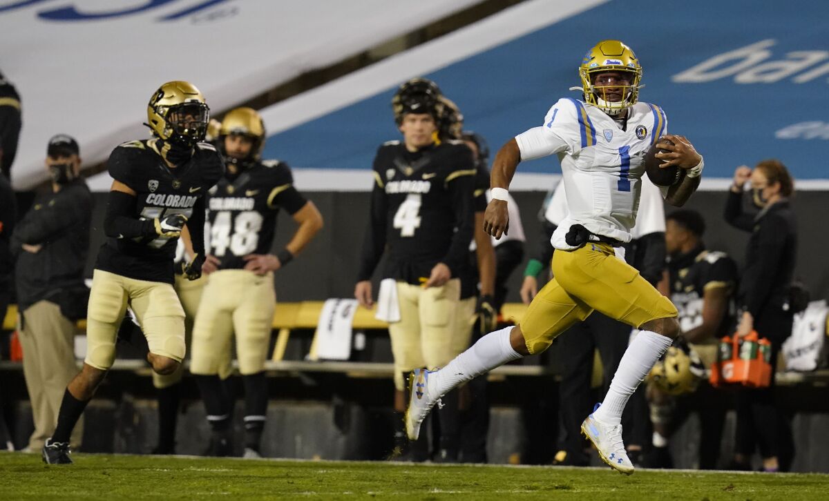 UCLA quarterback Dorian Thompson-Robinson runs with the football against Colorado on Nov. 7 in Boulder.
