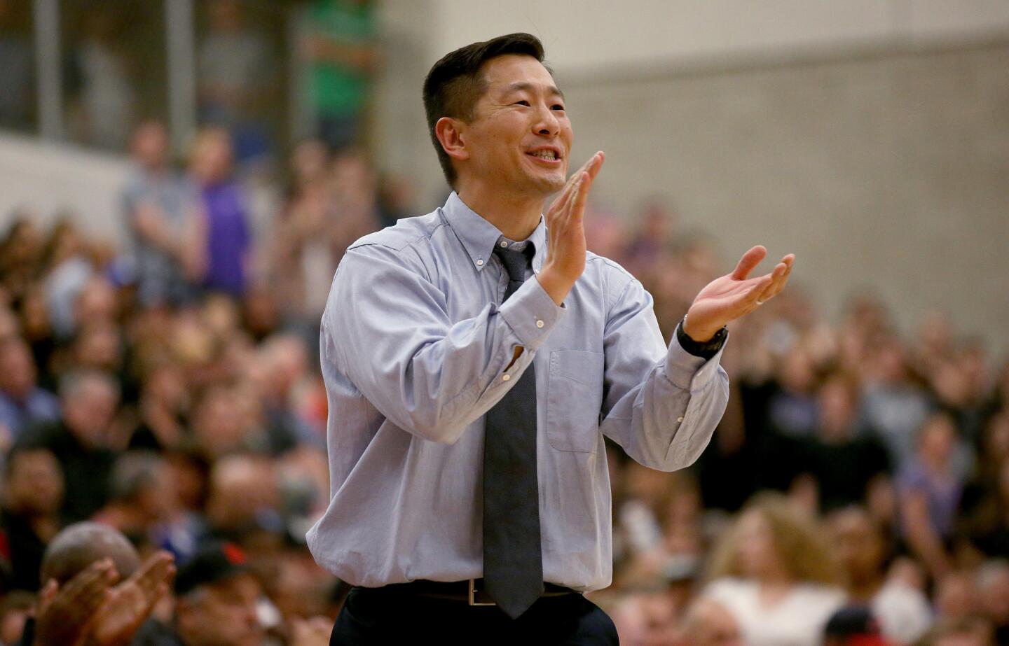 Chino Hills Coach Steve Baik cheers his team against Foothills Christian in the second half.
