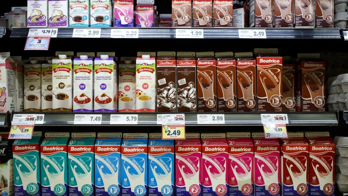 Canada will have to make more room for U.S. products in its dairy cases, such as this one in Caledon, under a newly renegotiated accord that revises the North American Free Trade Agreement.