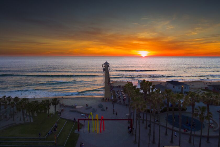 View from high above of Imperial Beach Pier during sunset.