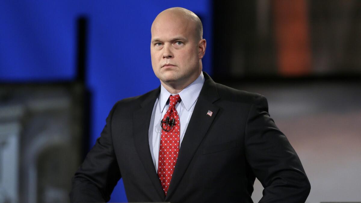 Acting Atty. Gen Matt Whitaker, shown in 2014, stepped into his new role on Wednesday.