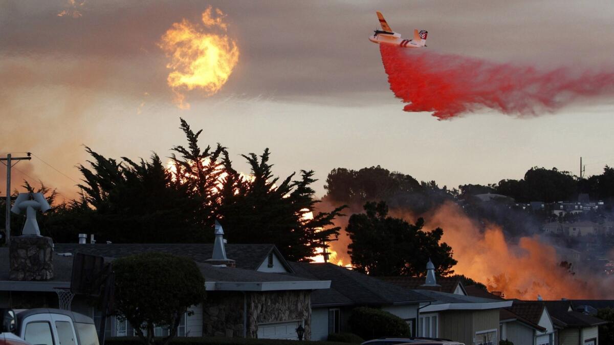 A massive fire following a pipeline explosion roars through a mostly residential neighborhood in San Bruno, Calif. on Sept. 9, 2010.