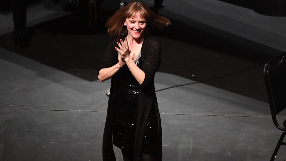 Ellen Reid acknowledges the audience for the Los Angeles Chamber Orchestra premiere of "Petrichor" at UCLA's Royce Hall.