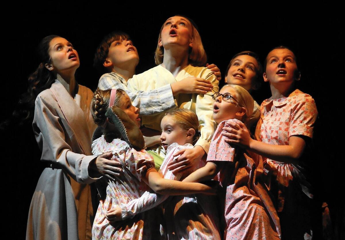 Maria (Kerstin Anderson) center, back row, and the Von Trapp children in “The Sound of Music.”