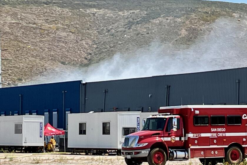 A battery fire continues to smolder at the Gateway Energy Storage facility in Otay Mesa on Tuesday, May 21.