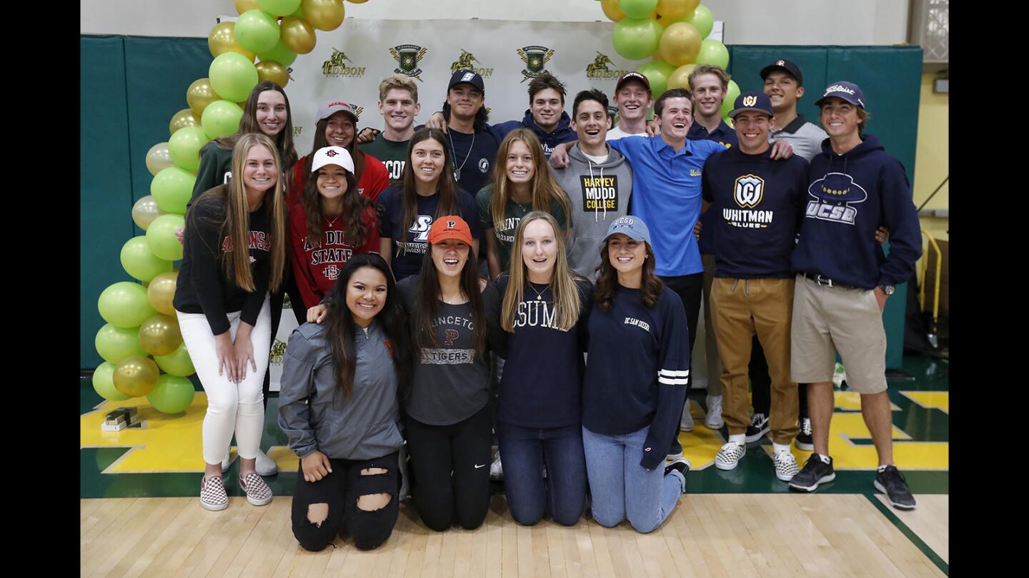 Twenty college-bound athletes pose for a group photo before their signing day ceremony at Edison High on Thursday.
