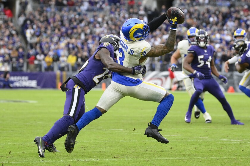 Los Angeles Rams wide receiver Odell Beckham Jr. (3) makes a catch as Baltimore Ravens cornerback Tavon Young defends during the second half of an NFL football game, Sunday, Jan. 2, 2022, in Baltimore. The Rams won 20-19. (AP Photo/Nick Wass)