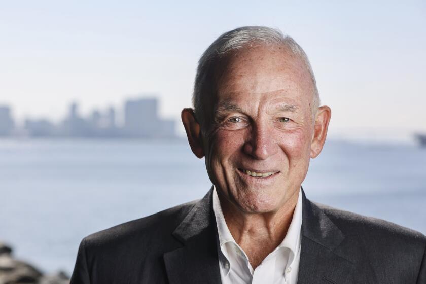 San Diego, CA - August 18: Former Mayor and Police Chief and now Chamber head Jerry Sanders poses for photos with the San Diego skyline on Harbor Island on Thursday, Aug. 18, 2022 in San Diego, CA. (Eduardo Contreras / The San Diego Union-Tribune)