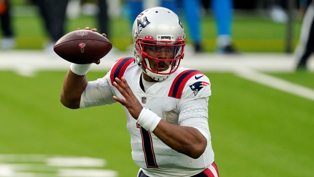 New England Patriots quarterback Cam Newton throws against the Chargers.