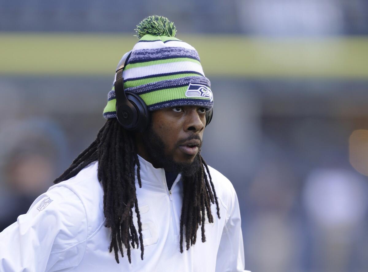 Seattle cornerback Richard Sherman walks onto the field to begin warming up for the game against Green Bay back in September.