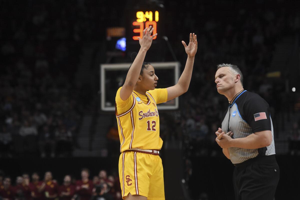 USC guard JuJu Watkins talks to a referee during the second half of the Trojans' 80-73 loss to Connecticut.