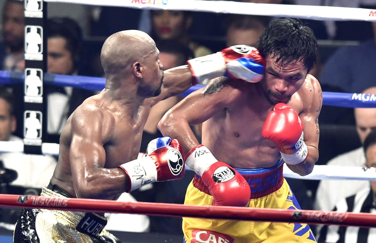 Floyd Mayweather Jr. lands a punch in the eighth round against Manny Pacquiao during their welterweight title fight on May 2, 2015.