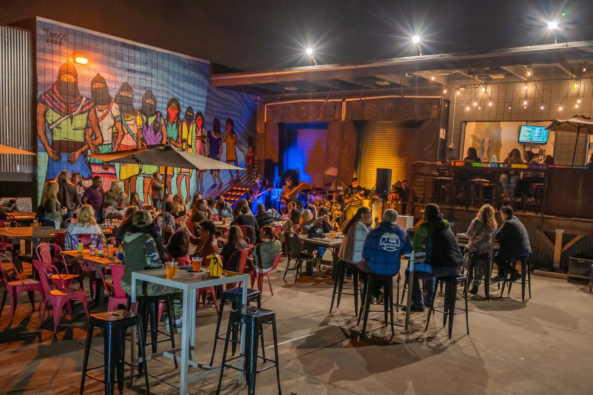 Patrons enjoy beers at Mujeres Brew House in Barrio Logan