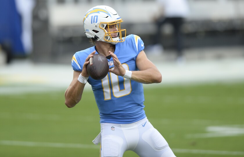 Chargers quarterback Justin Herbert warms up before a game at Tampa Bay.