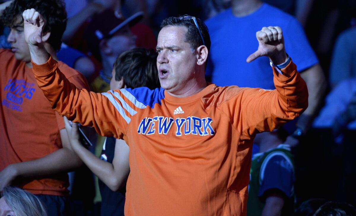 A New York Knicks fan shows his displeasure after his team selected Kristaps Porzingis of Latvia with the fourth overall pick of the NBA draft.