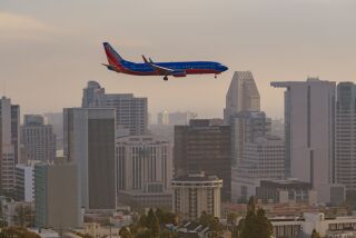 Passenger airliner on approach to San Diego International Airport.