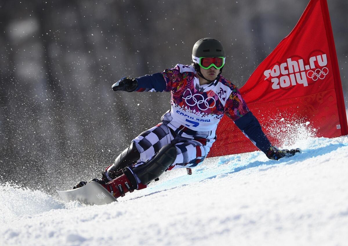 Vic Wild claimed the gold medal in the men's snowboard parallel giant slalom (above) Wednesday and the parallel slalom on Saturday for Russia, the country he left the United States for in 2011.