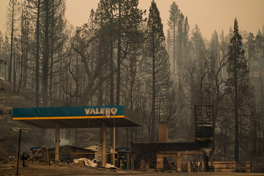 FRESNO COUNTY, CA - SEPTEMBER 08: The smoldering remains of Cressman's General Store and Gas Station along CA-168, where Creek Fire tore through and jumped CA-168 on Tuesday, Sept. 8, 2020 in Fresno County, CA. (Kent Nishimura / Los Angeles Times)
