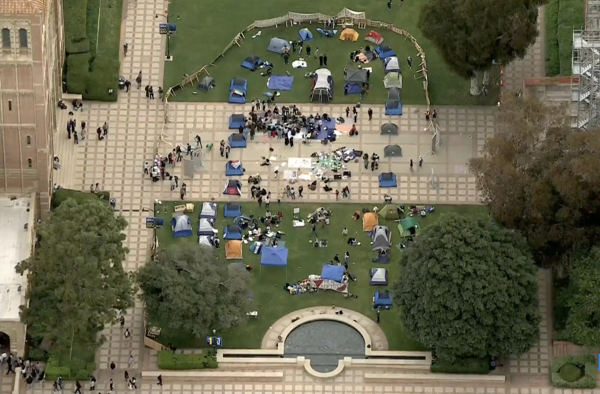 Pro-Palestinian protesters form an encampment outside UCLA's Royce Hall.