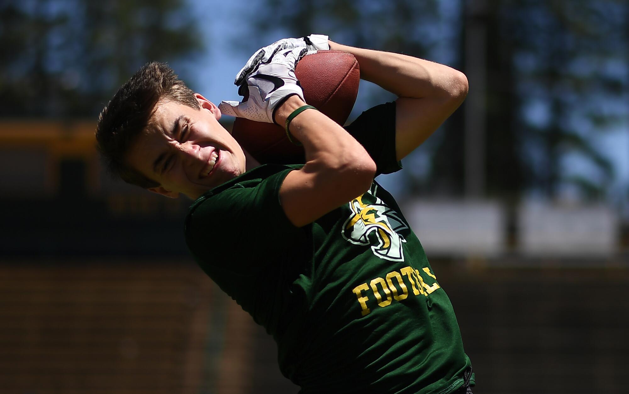 Mason Cowan makes a catch during Paradise High football practice.