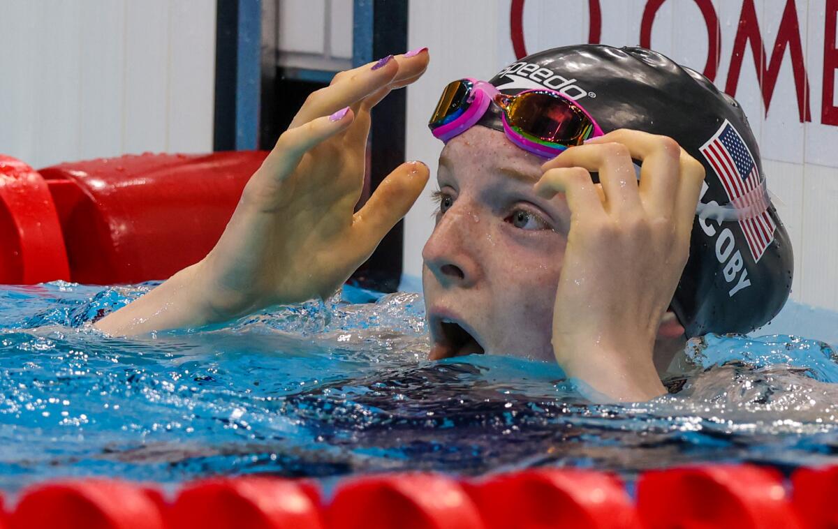 U.S. swimmer Lydia Jacoby reacts after winning gold in the women's 100-meter breaststroke at the Tokyo Olympics.