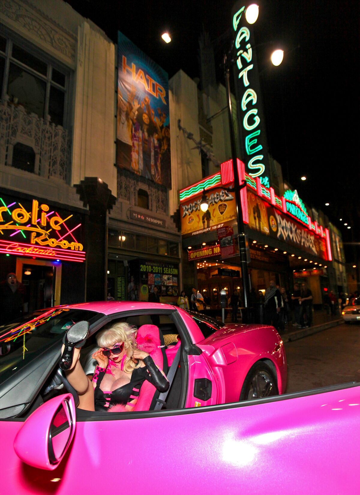 Angelyne in her pink Corvette at the opening night of "Rock Of Ages" at the Pantages Theatre