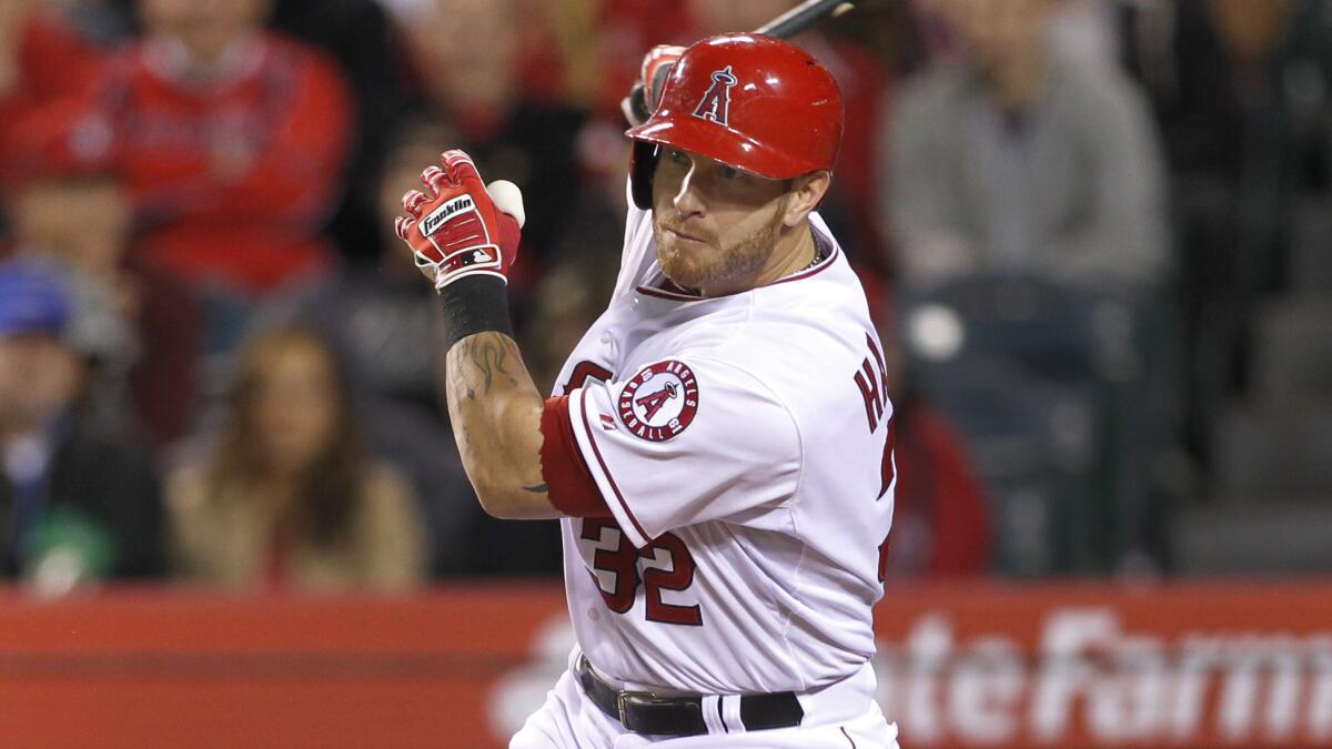 Angels outfielder Josh Hamilton doubles during a game against the Seattle Mariners on April 1, 2014. MLB Commissioner Rob Manfred is expected to make a decision on Hamilton's status before the Angels' season opener.