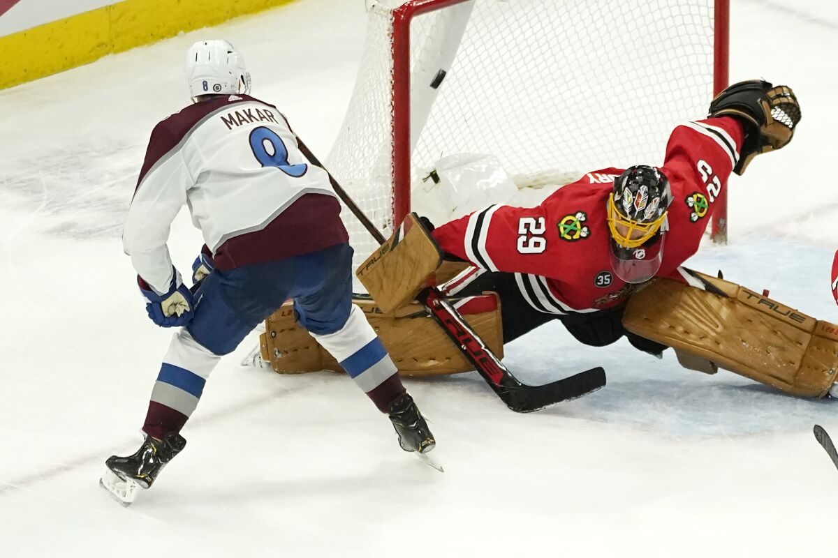 Colorado Avalanche's Cale Makar (8) scores the game winning goal past Chicago Blackhawks goaltender Marc-Andre Fleury during the overtime period of an NHL hockey game Tuesday, Jan. 4, 2022, in Chicago. The Avalanche won 4-3. (AP Photo/Charles Rex Arbogast)