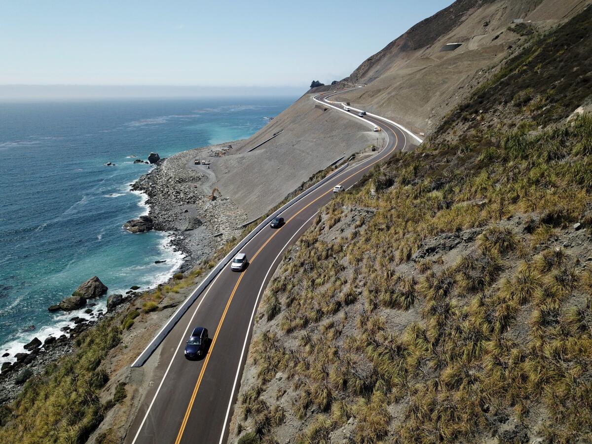 Cars cruise along the newly reconstructed roadway in the slide zone at Mud Creek along the Big Sur coast on Highway 1.