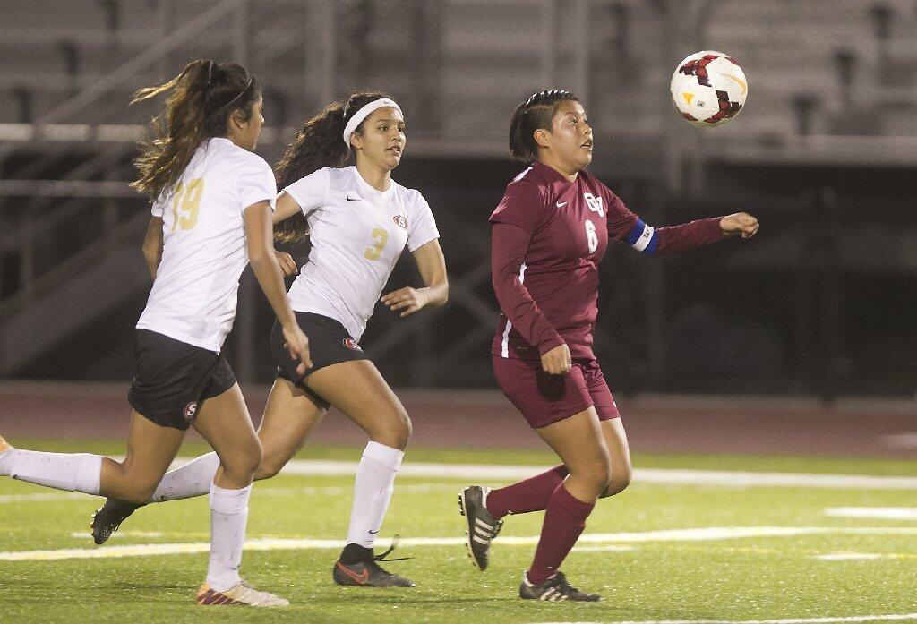 Ocean View's Daisy Moran, right, takes control of the ball against Segerstrom defenders.