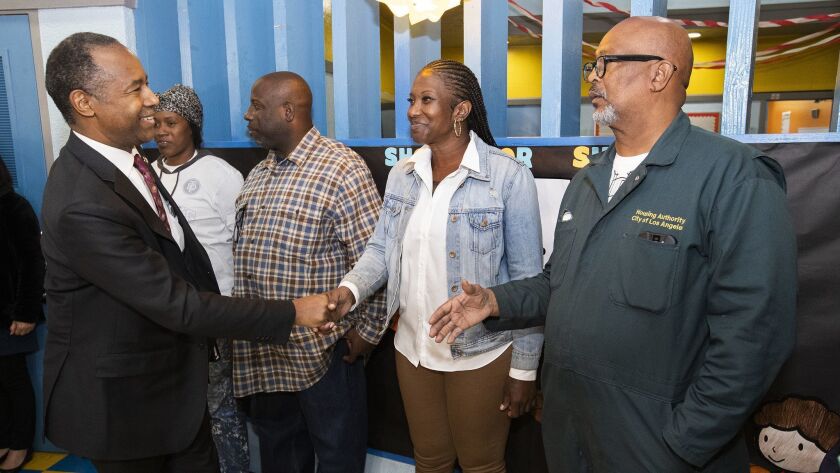 HUD Secretary Ben Carson greets Julie Legardye, 32; Eddie Williams, 47; Chica Caldwell, 42; and Donny Joubert, 58, residents of Nickerson Gardens, which is receiving a $3.7-million grant for a job center.