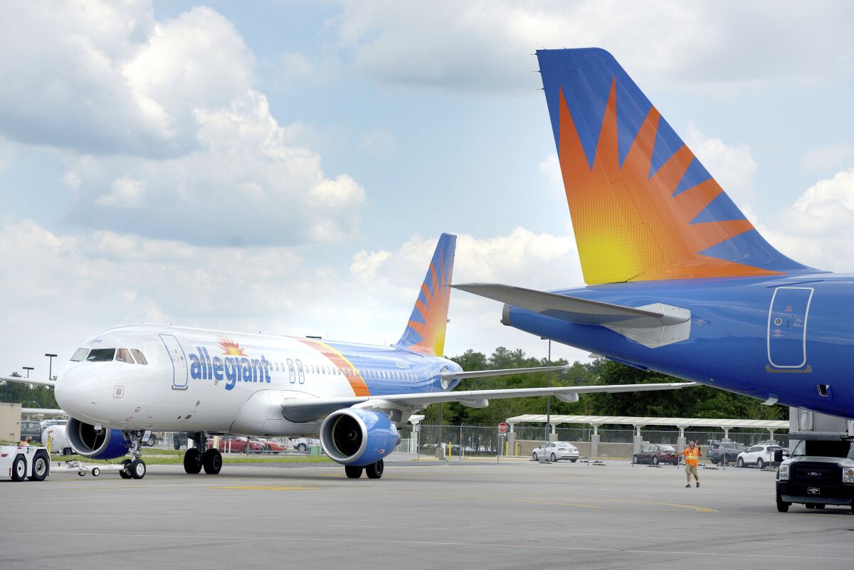 FILE - An Allegiant Air flight to Bellville, Ill., taxis at Destin-Fort Walton Beach Airport on Wednesday June 6, 2018, in Valparaiso, Fla. Allegiant Air is ordering new planes from Boeing. Allegiant said Wednesday, Jan. 5, 2022, that it will buy 50 Boeing 737 Max jets and take options for 50 more. (Nick Tomecek/Northwest Florida Daily News via AP)